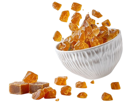 Minimalistic_Ceramic_Bowl_Overflowing_With_Golden_Jaggery-removebg-preview